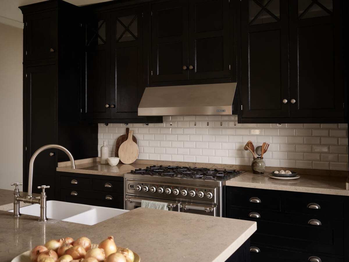 A Grand Early 20th-Century Apartment in Stockholm 6 black kitchen white tiles