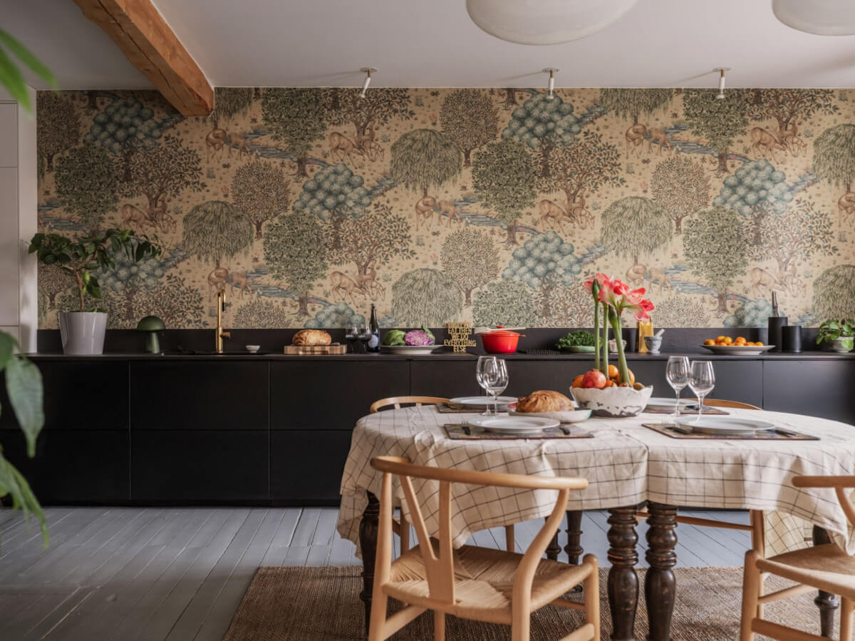 Painted Floorboards in a Unique Family Home in Sweden 5 black kitchen with william morris wallpaper and round dining table nordroom