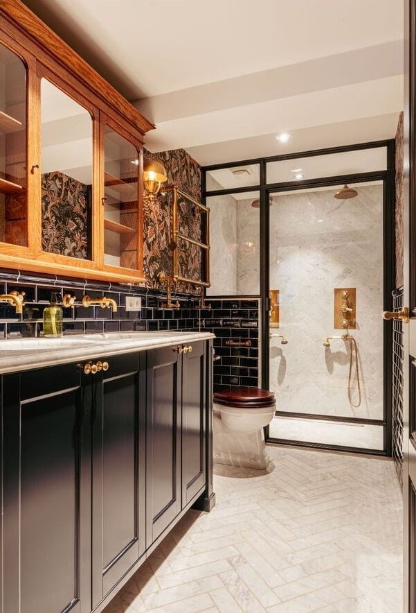 A Unique Ground Floor Duplex Apartment in Amsterdam 25 black subway tiles wallpapar and brass fittings bathroom