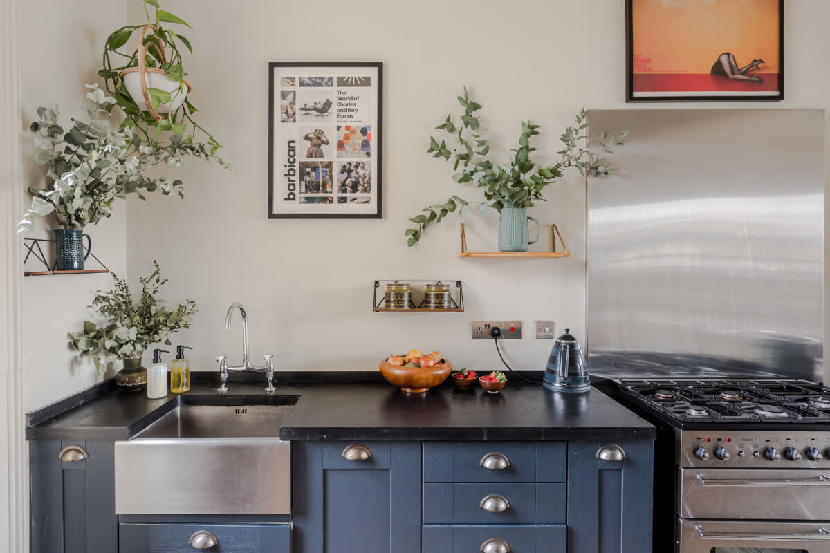 Timeworn Original Floorboards in a Regency Seaside Home 8 blue kitchen cabinets black countertop