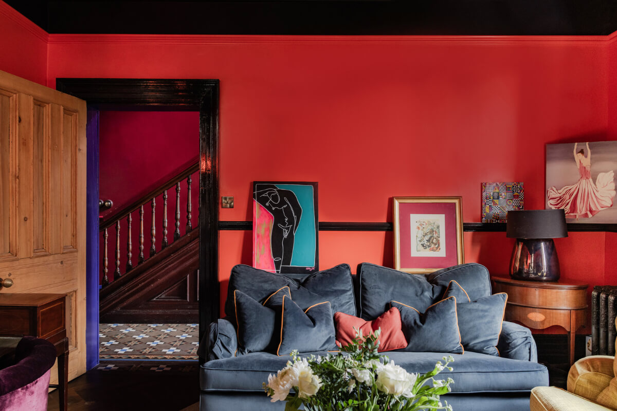 A Grand Victorian Villa in Manchester with Bold Interiors 2 bold red and black sitting room