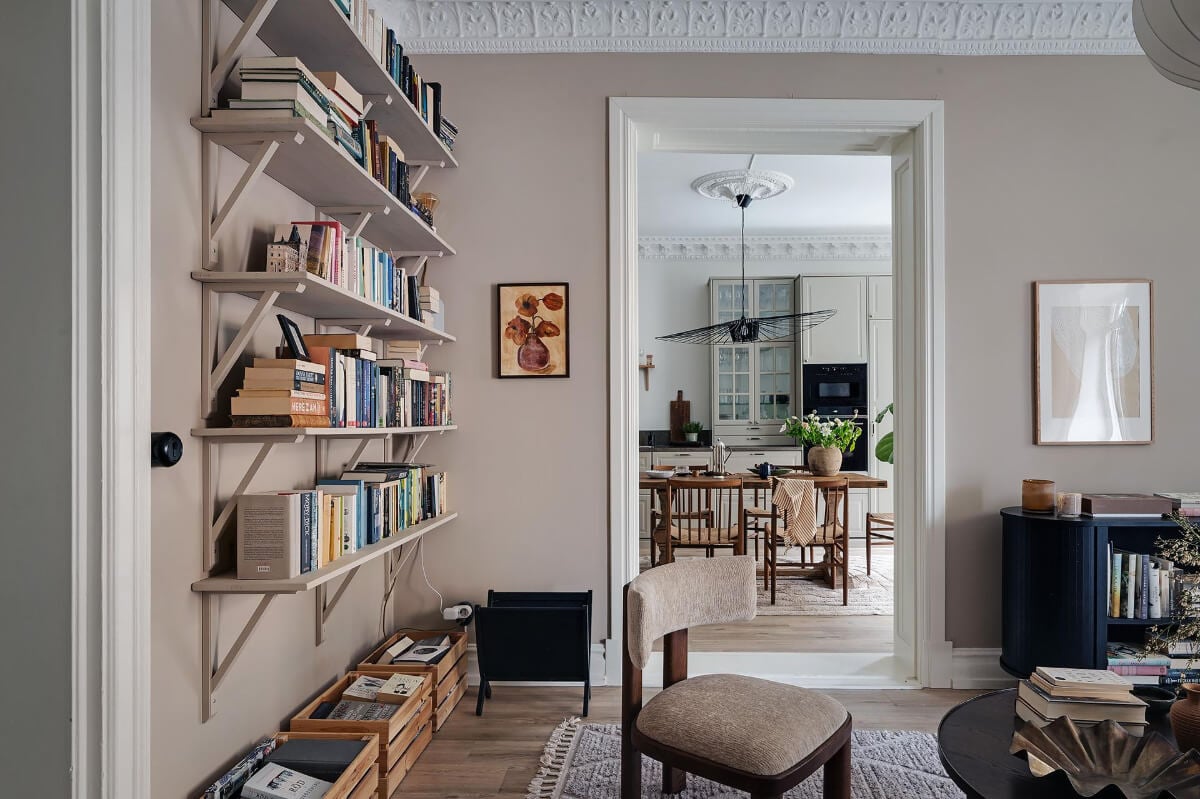 Warm and Inviting Rooms in a Renovated Swedish Apartment 10 bookshelves and views of kitchen