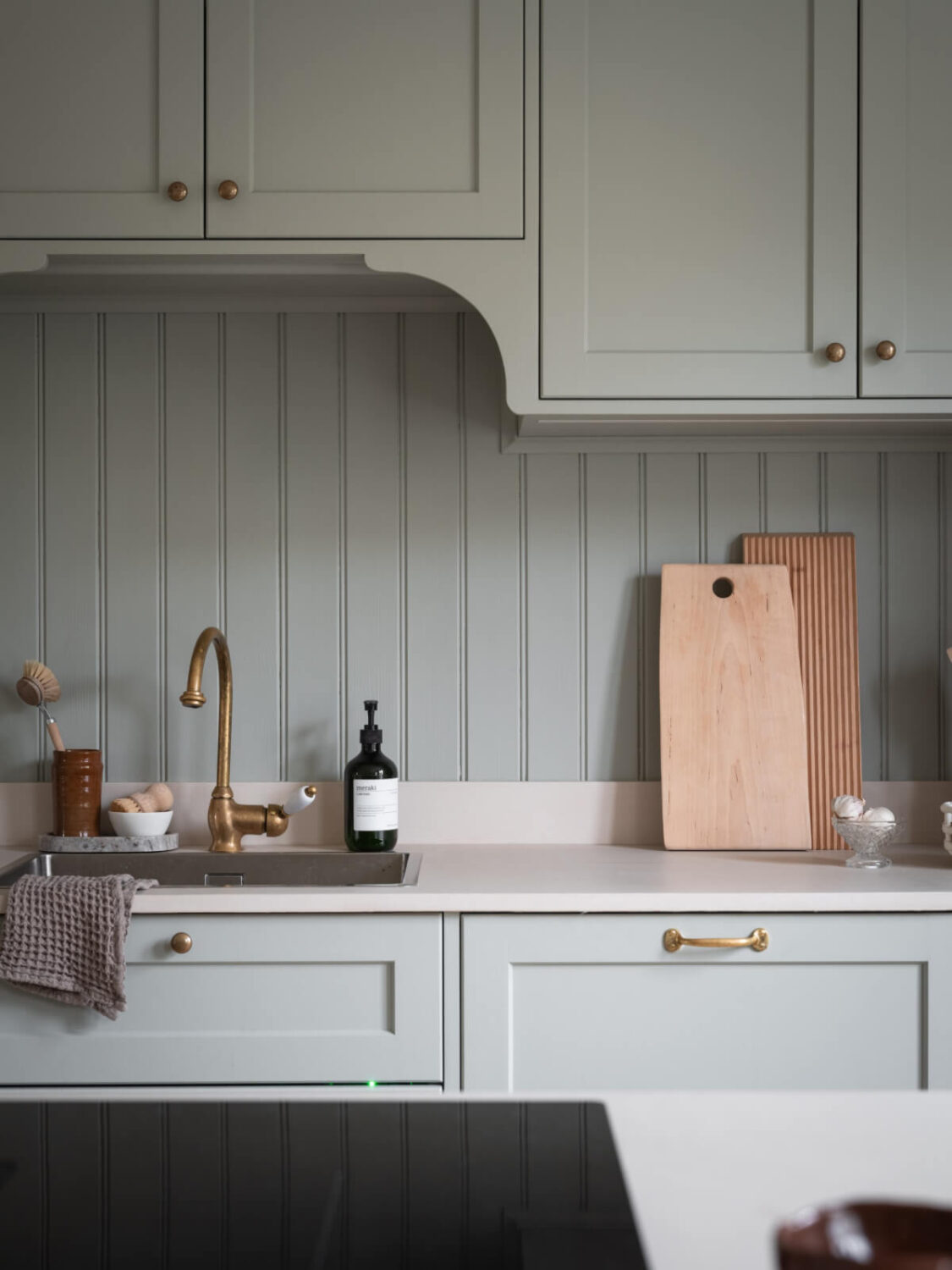A Carefully Renovated Family Home in Sweden 11 brass fittings kitchen detail