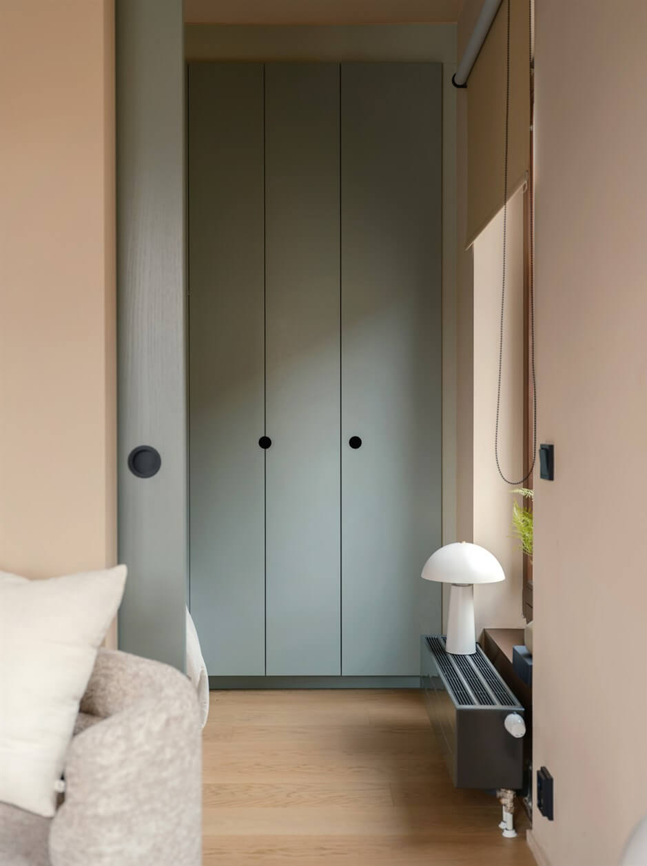 A Small Modern Stockholm Apartment with Smart Storage Solutions 11 built-in floor to ceiling wardrobes