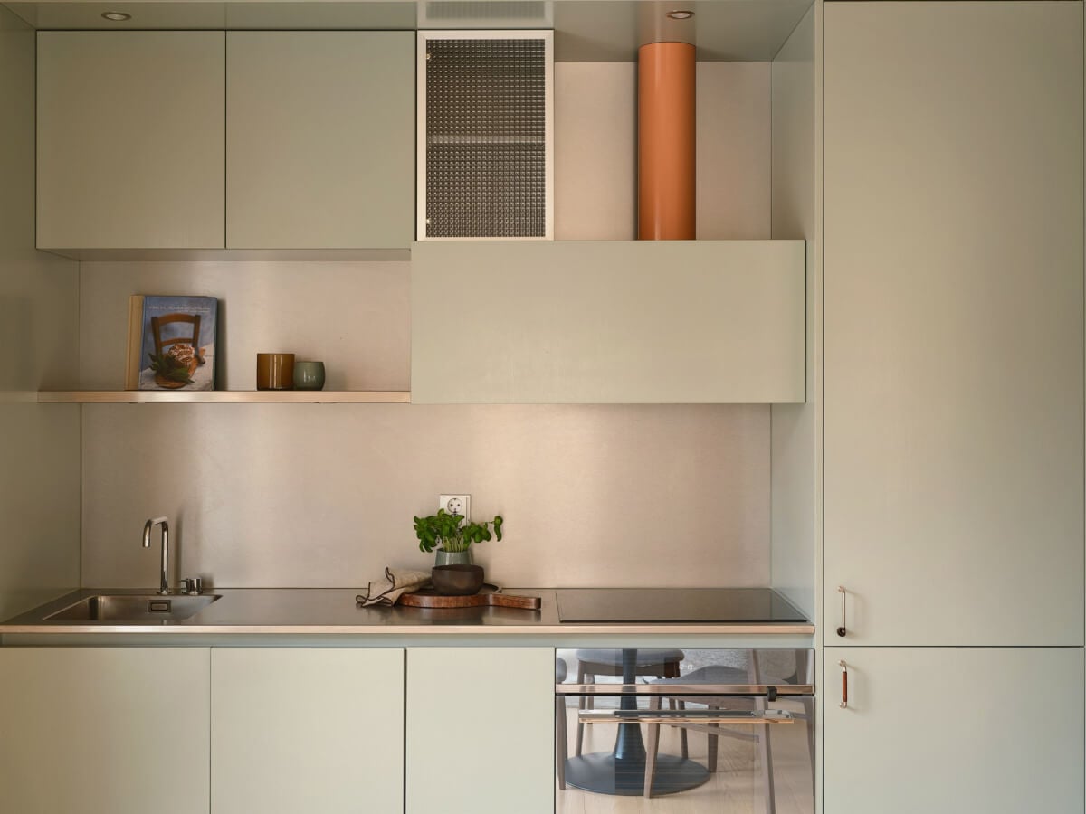 A Small Modern Stockholm Apartment with Smart Storage Solutions 13 built in kitchen shelves and closed cabinets