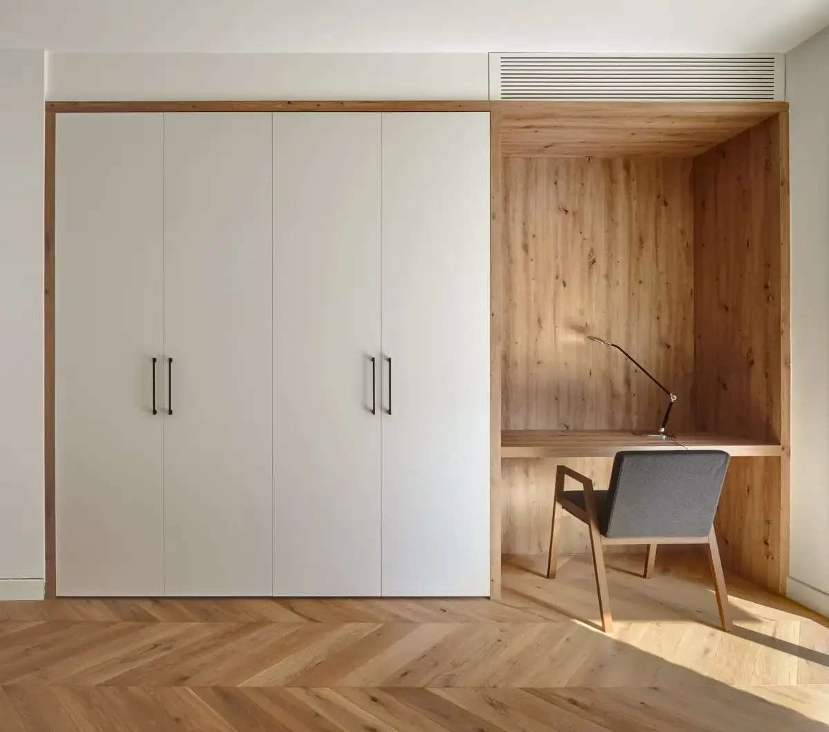 A Modern Barcelona Apartment with a Pink Bathroom 17 built-in wardrobes and desk