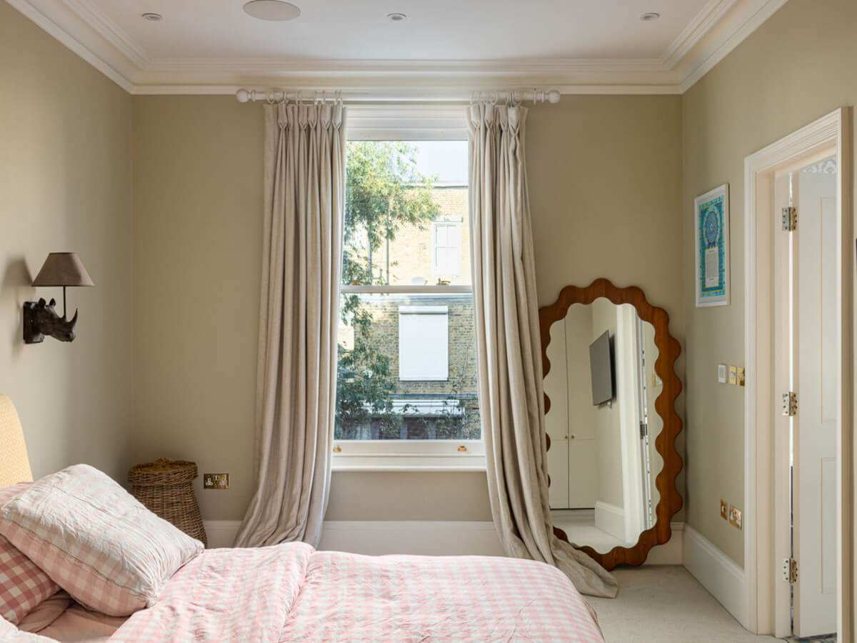 An Extended Family Home in London with Pink Crittall Doors 9 calm colored bedroom light pink bedding