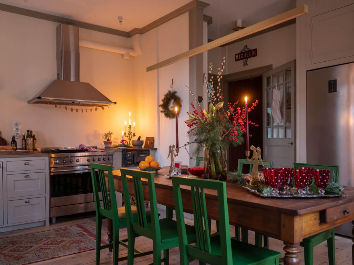 A Beautiful Turn-of-the-Century Family Home in Sweden 15 charming kitchen rustic wooden table green chairs