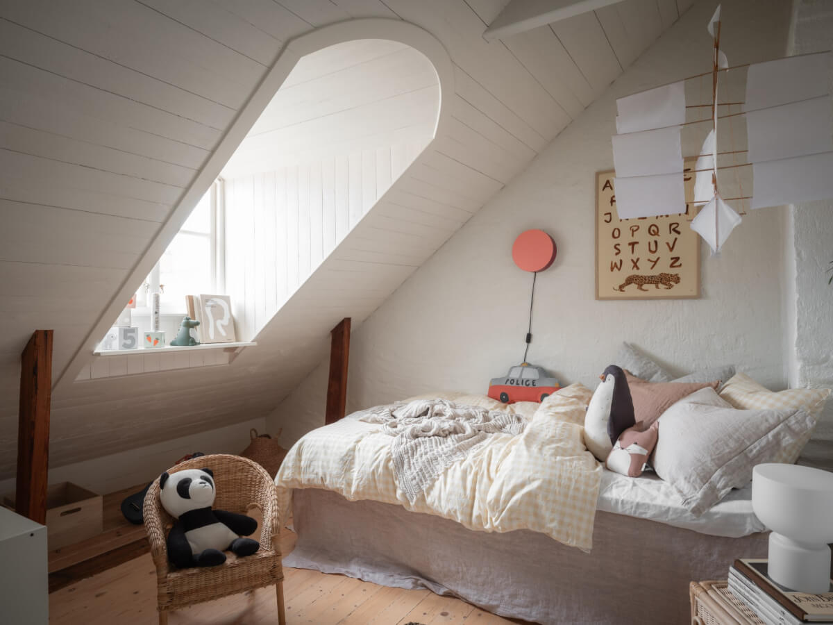 A Renovated Duplex Apartment with Exposed Brick Walls 21 childrens bedroom slanted ceiling dormer window