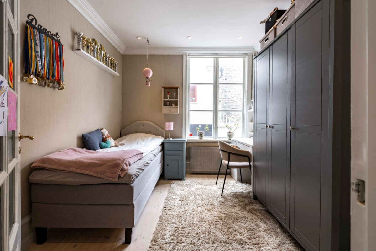 A Renovated 19th-Century Villa on Gotland 16 childrens room with desk and large wardrobes