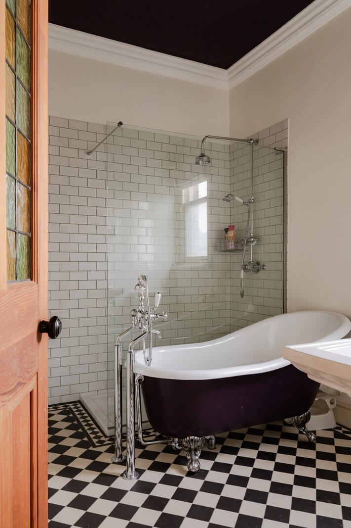 A Grand Victorian Villa in Manchester with Bold Interiors 30 classic bathroom black clawfoot bath walk-in shower checkerboard floor nordroom