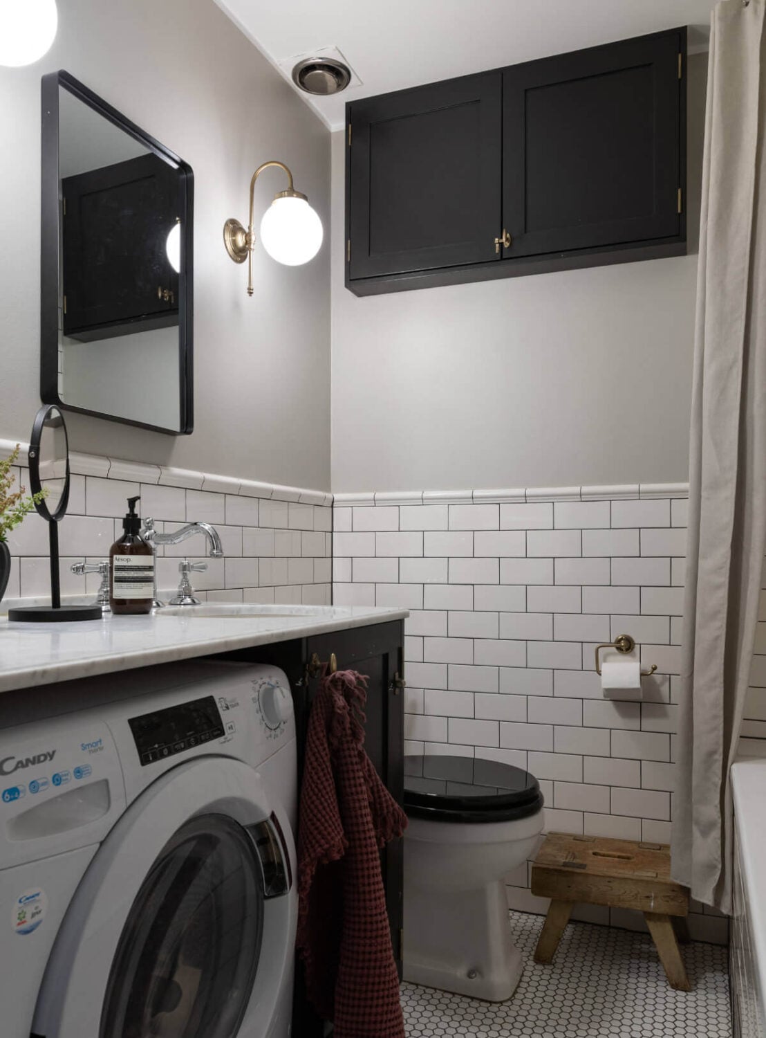 A Charming Ground Floor Apartment with a Large Patio Garden 18 classic bathroom white tiles washing machine marble top