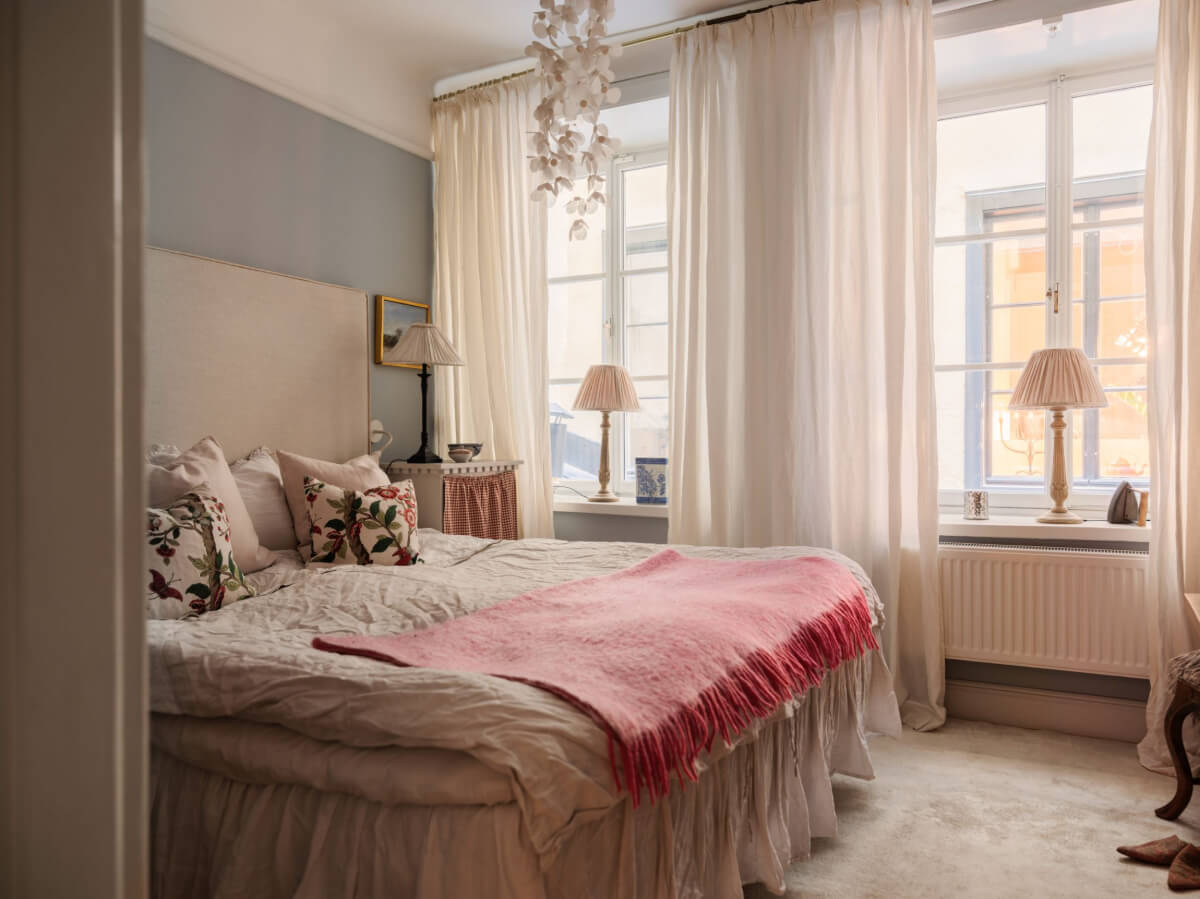 A Charming Home in a 17-Century Apartment in Stockholm's Old Town 18 classic bedroom light blue walls