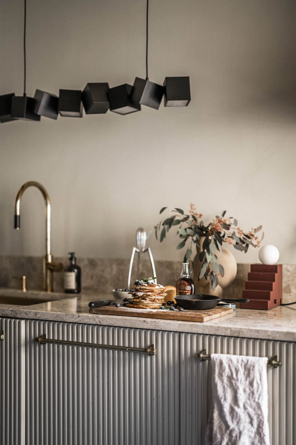 A Swedish Apartment with Exclusive Materials and Monochrome Color Scheme 8 classic kitchen design lamps