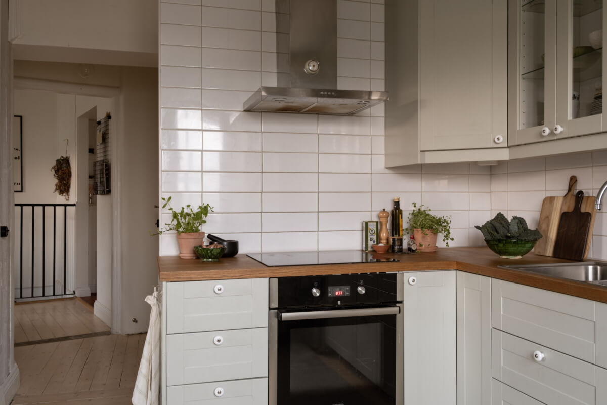 A Swedish Maisonette Apartment with Basement Bedrooms 8 classic kitchen white tiles