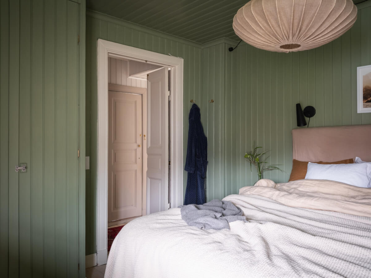 A Carefully Renovated Family Home in Sweden 30 color-drenched green bedroom