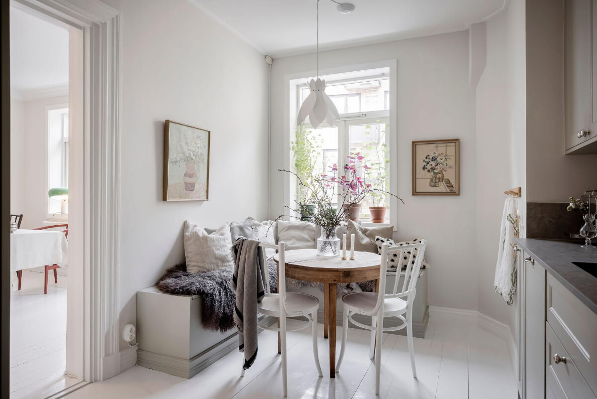 White-Painted Floorboards in a Turn-of-the-Century Apartment 14 corner bench breakfast nook