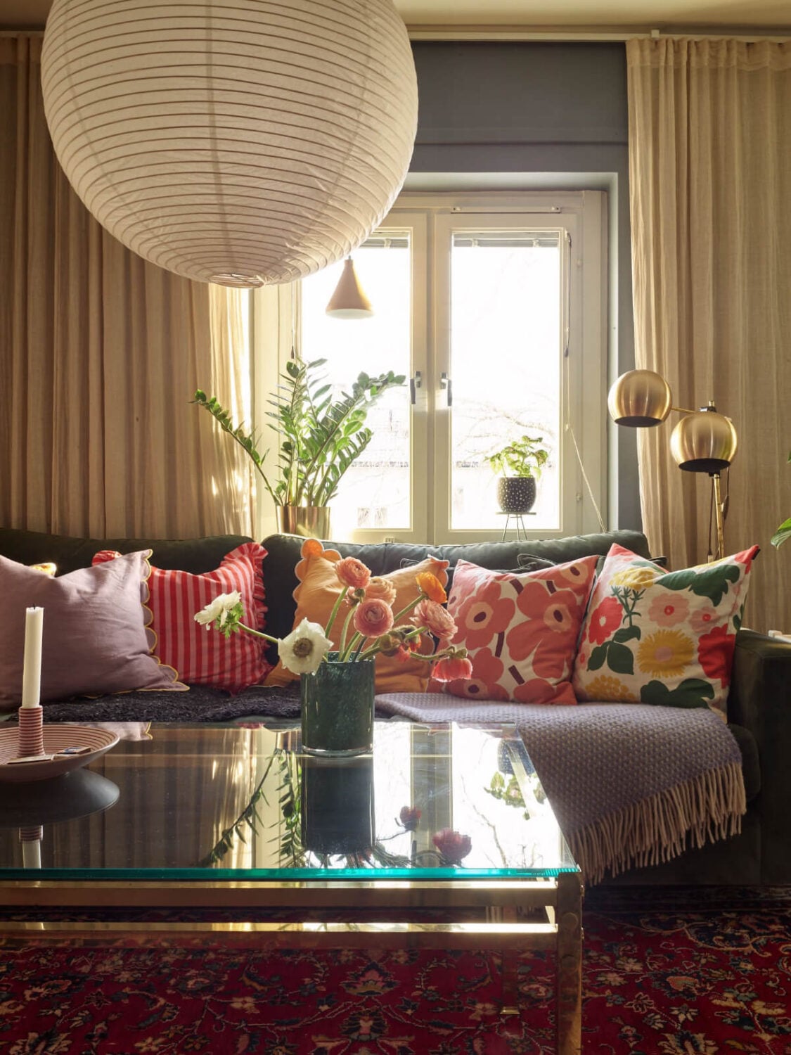 A Colorful Midcentury Apartment Filled with Art and Plants 5 cozy living room detail