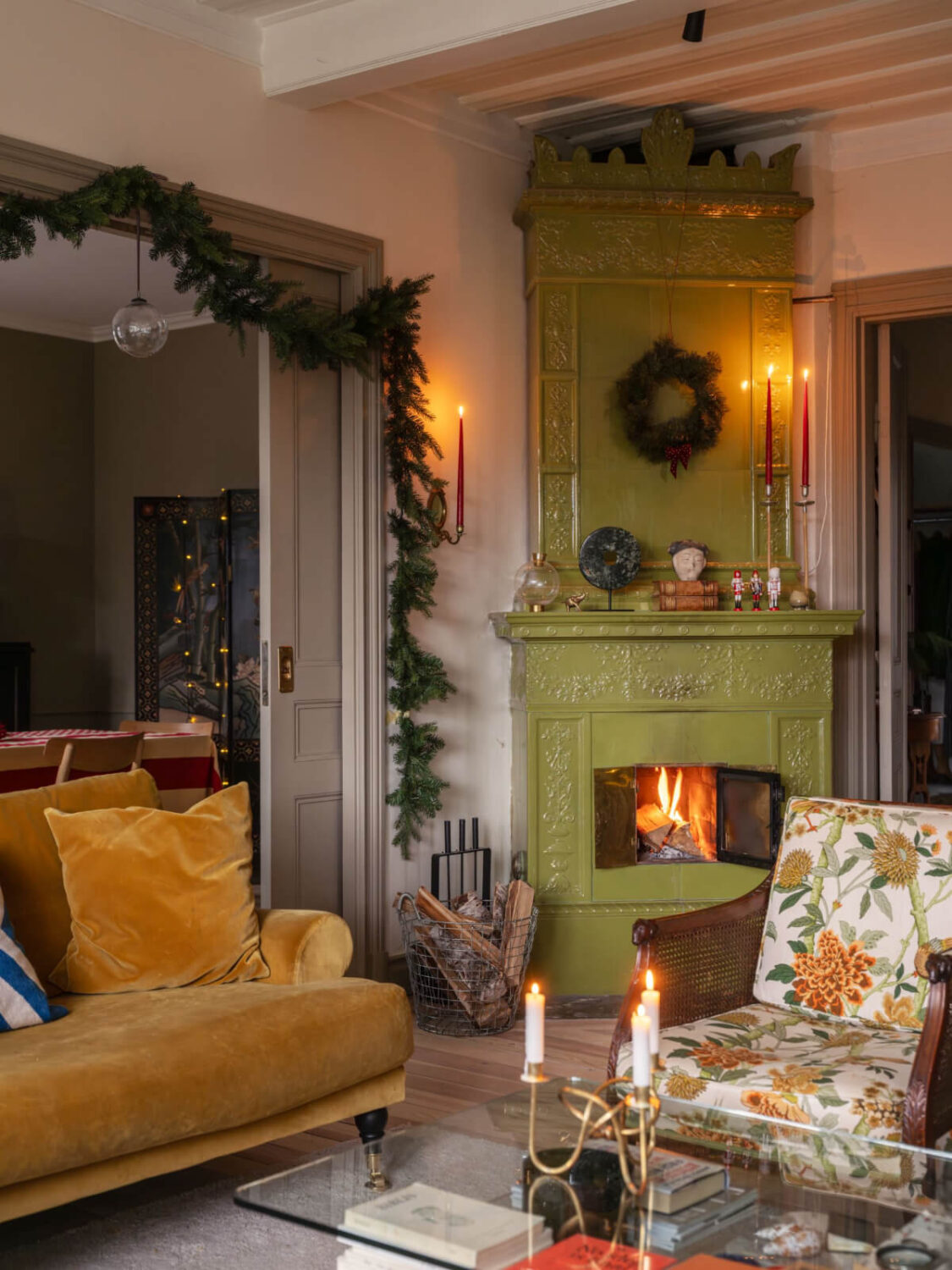 A Beautiful Turn-of-the-Century Family Home in Sweden 2 cozy living room green fireplace