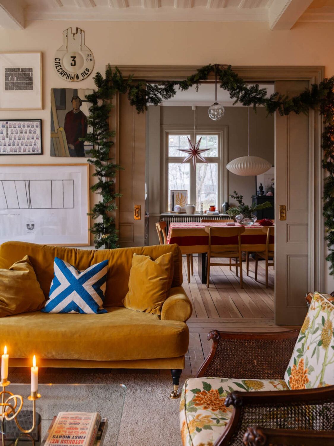 A Beautiful Turn-of-the-Century Family Home in Sweden 9 cozy living room ochre sofa christmas garland