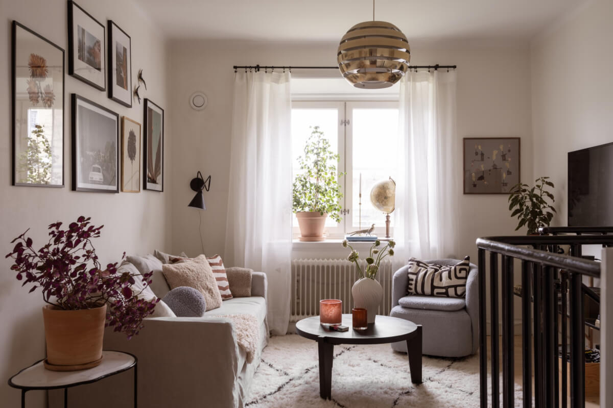 A Swedish Maisonette Apartment with Basement Bedrooms 1 cozy living room scandinavian style large rug