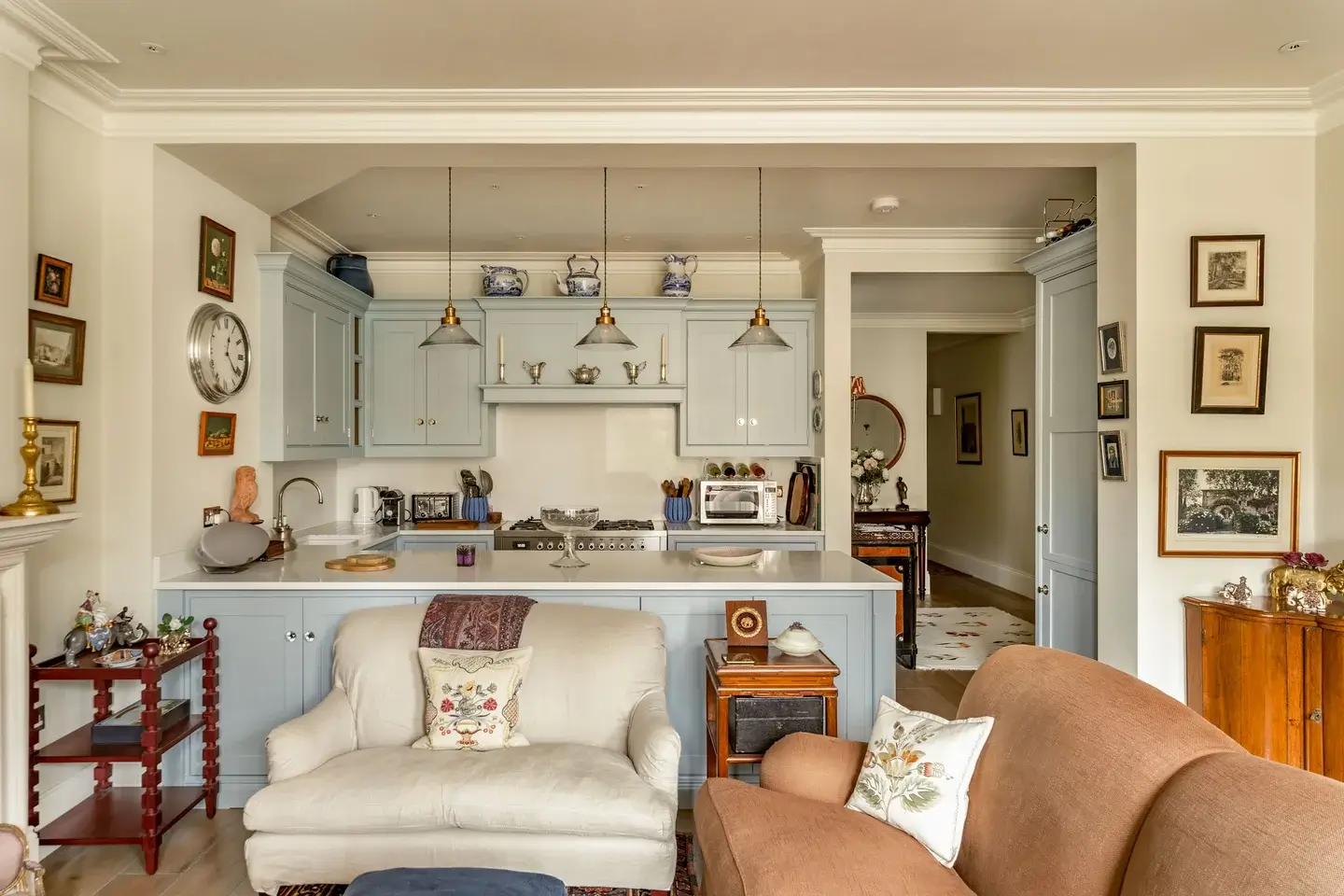 Classic Interiors and Antiques in an Art-Filled London Apartment 3 cozy living space antique furniture blue-gray kitchen