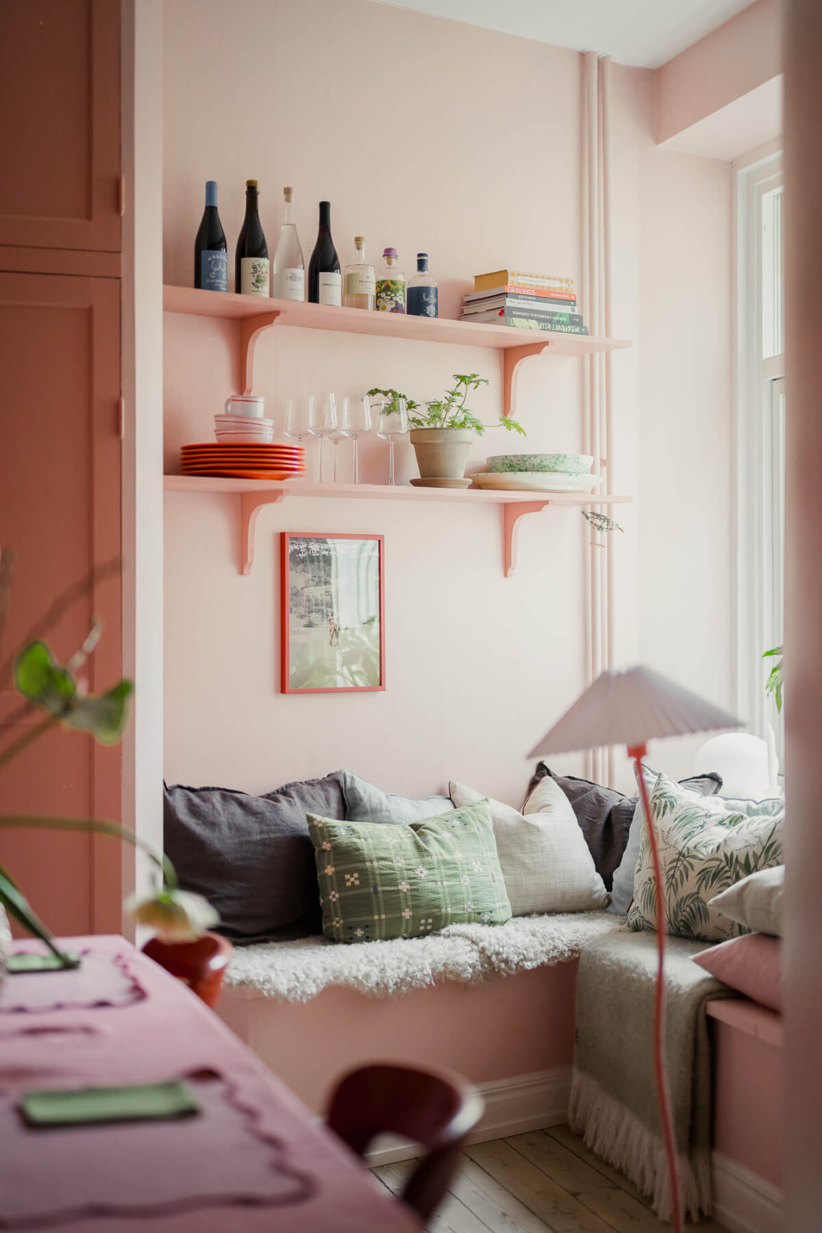 cozy window seat with shelves pink kitchen