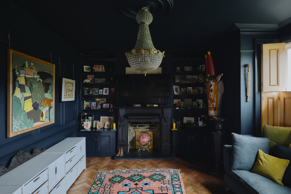 A London Edwardian House with a Light-Filled Kitchen Extension 16 dark blue color drenched sitting room herringbone parquet floor