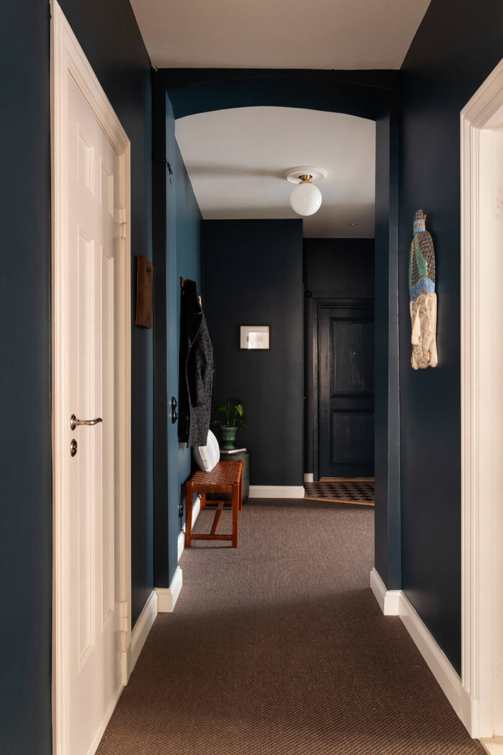 Contrasting Colors in a Turn-of-the-Century Apartment in Stockholm 21 dark blue hall with carpet Contrasting Colors in a Turn-of-the-Century Apartment in Stockholm