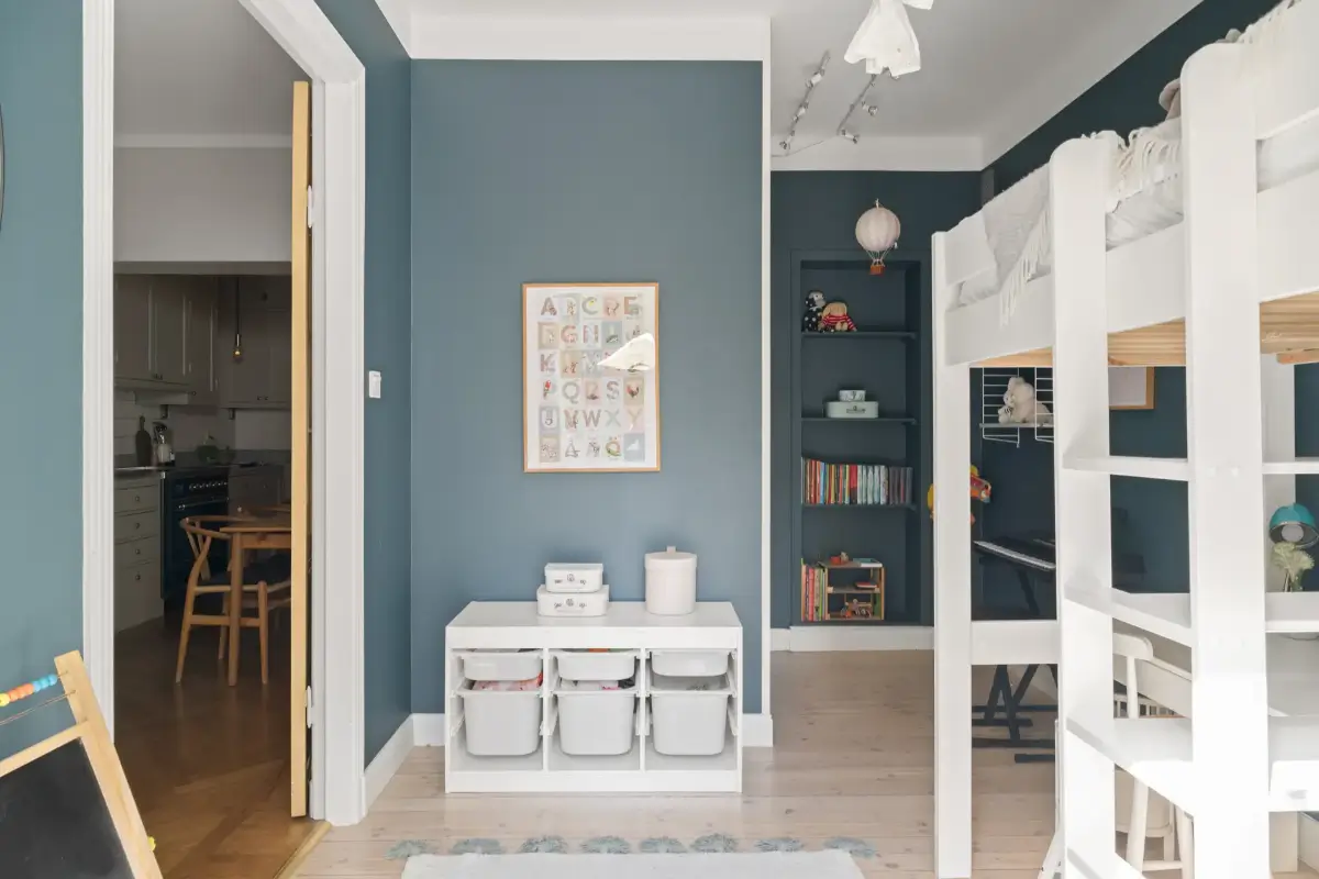 A Charming Ground Floor Family Apartment in Stockholm 12 dark blue kids bedroom wooden floor