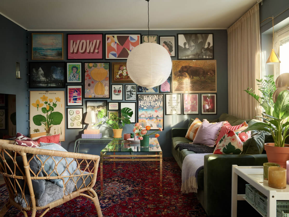 A Colorful Midcentury Apartment Filled with Art and Plants 1 dark blue living room gallery wall large rug