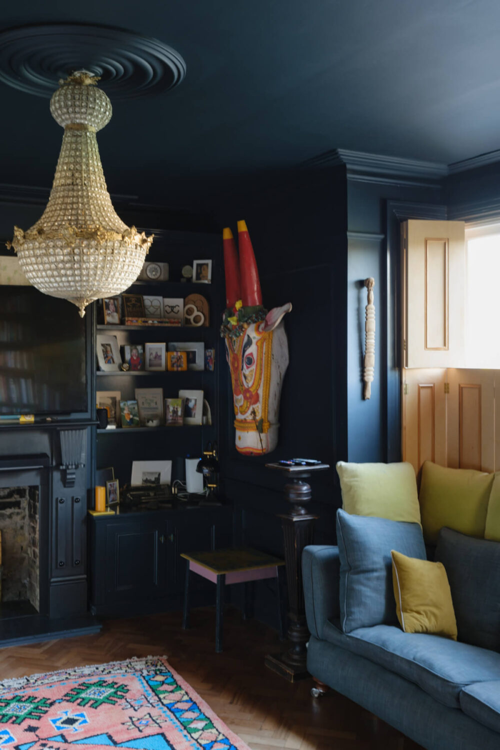 A London Edwardian House with a Light-Filled Kitchen Extension 15 dark blue living room with yellow window shutters