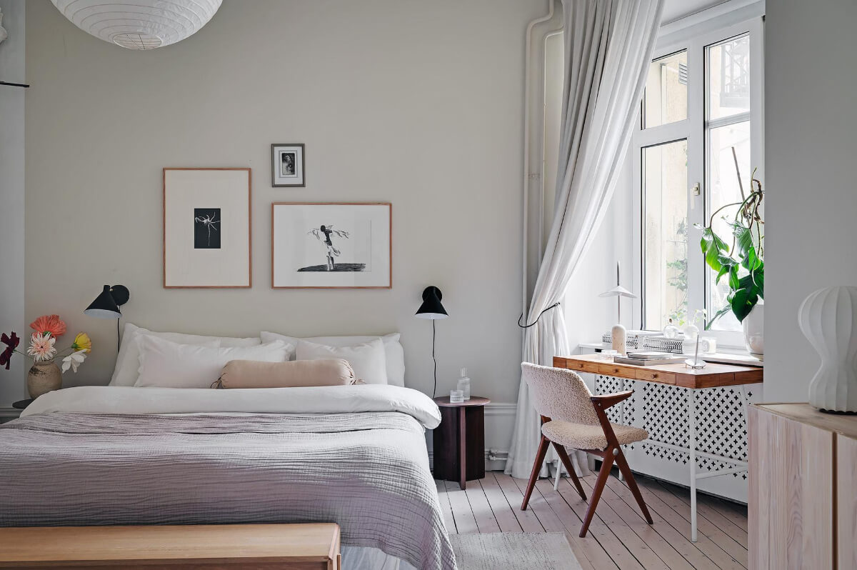 Period Features and Modern Materials in a Swedish Apartment 18 desk under window