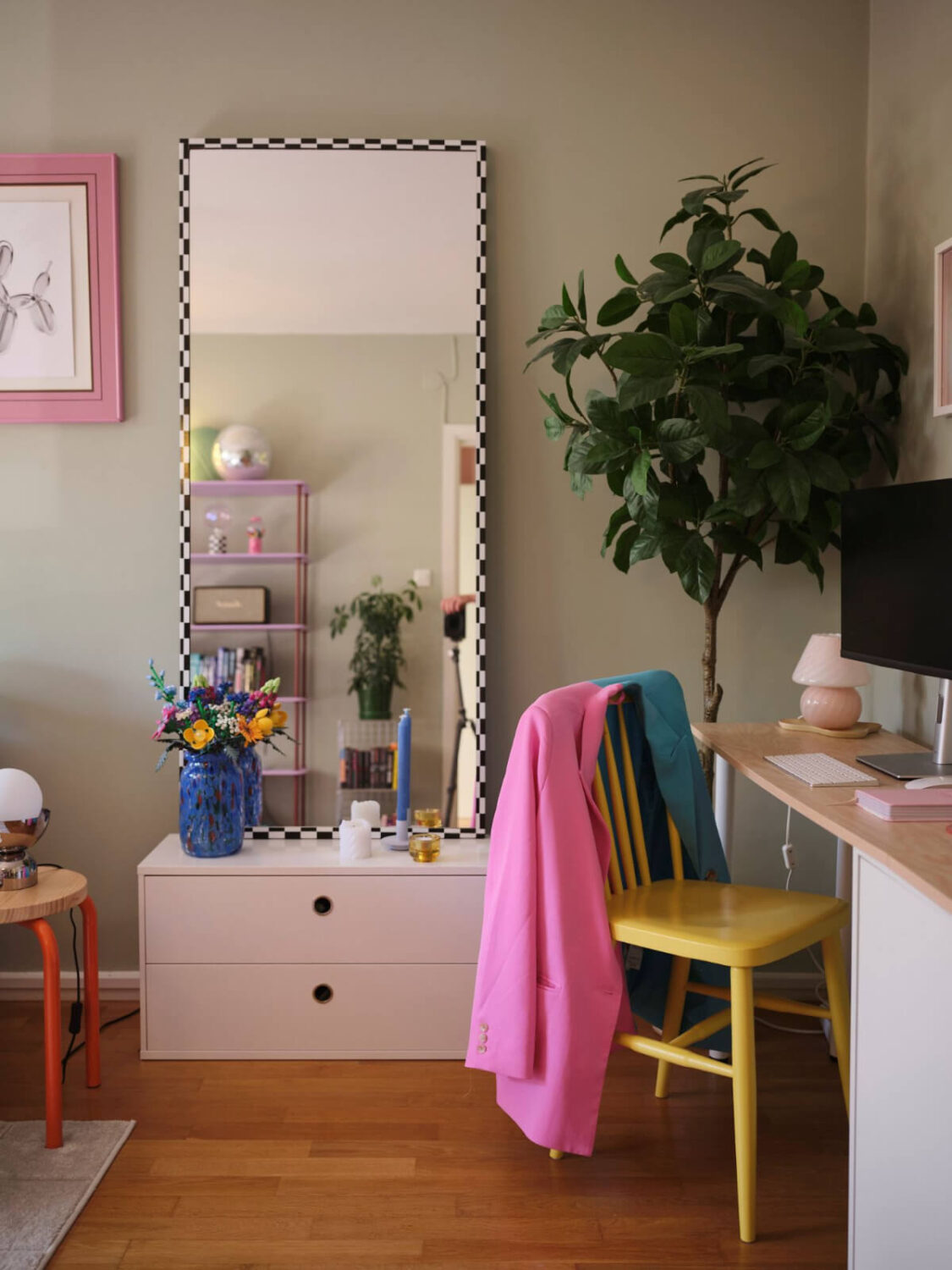 A Midcentury Swedish Apartment with Bright Color Accents 7 desk with yellow chair