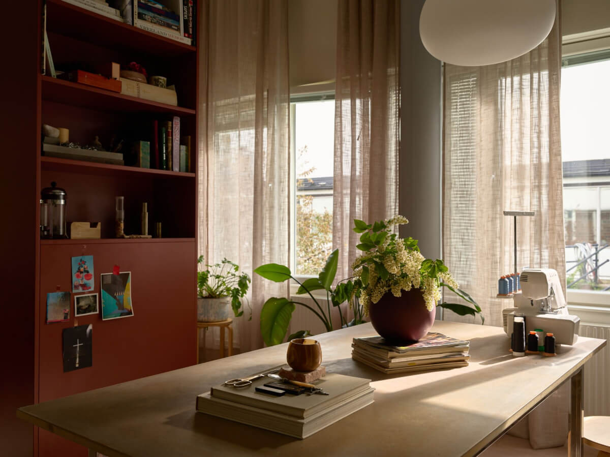 High Ceilings in a Small Swedish Loft Designed for a Family 6 dining room and storage cabinet