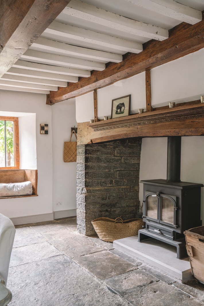 A Beautiful Renovated Country House in England 11 dining room fireplace and window seat