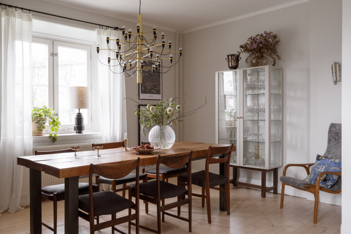 A Swedish Maisonette Apartment with Basement Bedrooms 9 dining room large wooden table