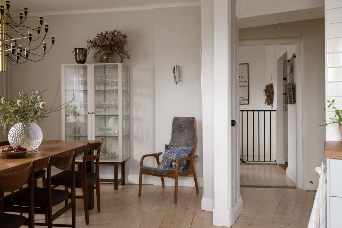 A Swedish Maisonette Apartment with Basement Bedrooms 14 dining room light gray walls wooden floor