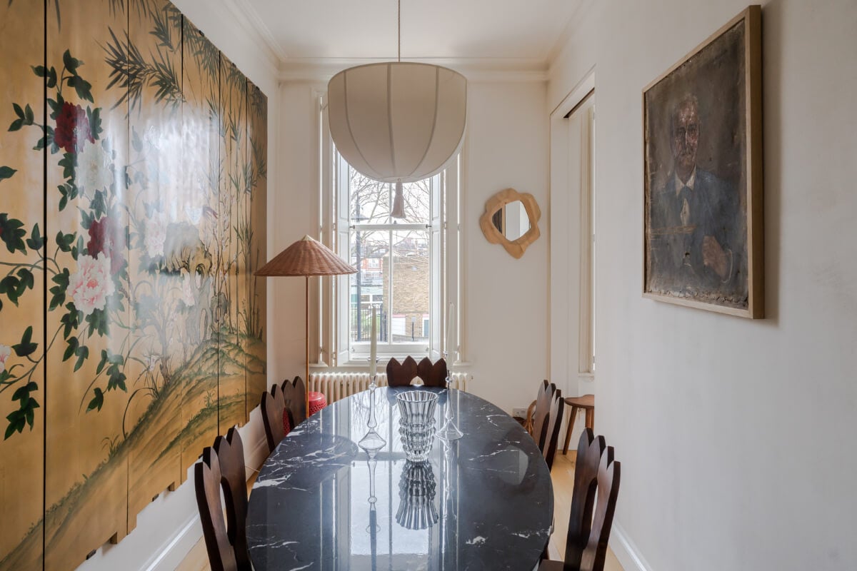 Cozy Contemporary Spaces in a Light-Filled Victorian Apartment 11 dining room oval marble table