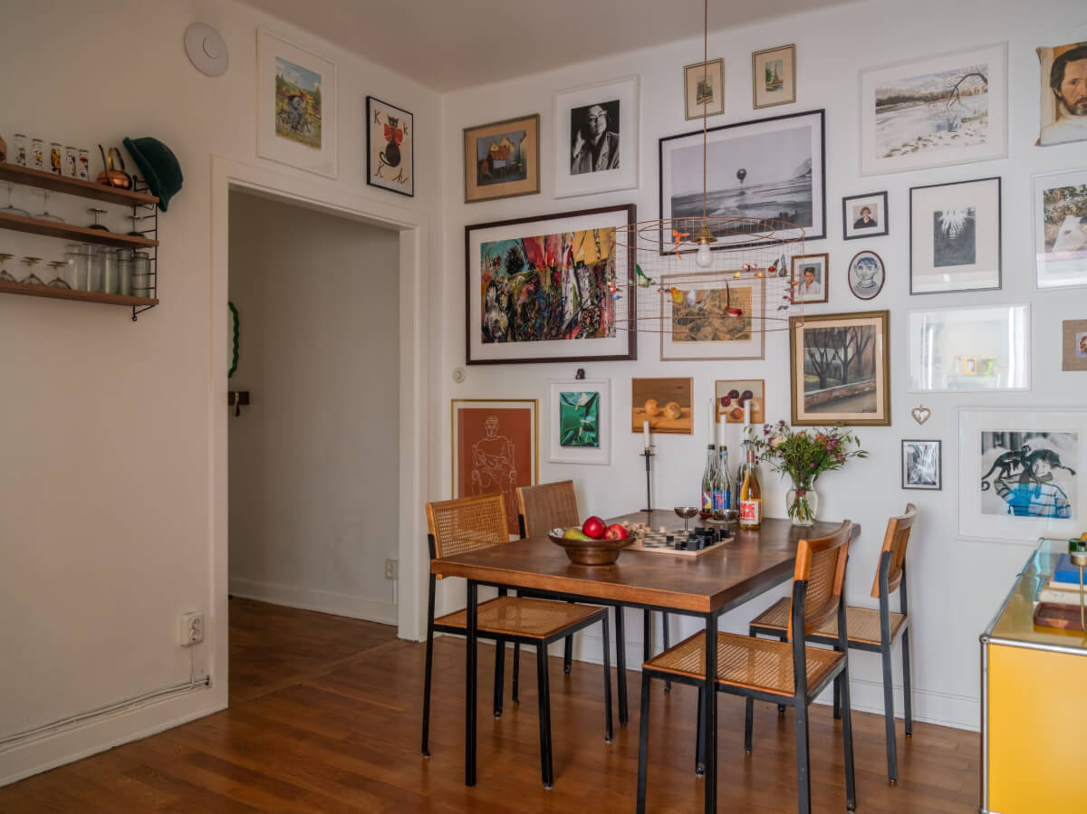An Airy One-Bedroom Apartment with Art and A Yellow Kitchen 16 dining room with art