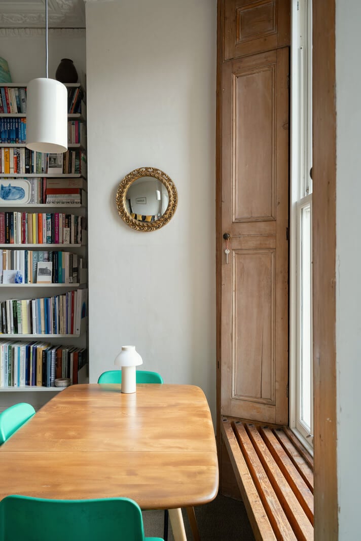 A Light One-Bedroom Apartment in a Victorian Terrace House 7 dining table in front of window