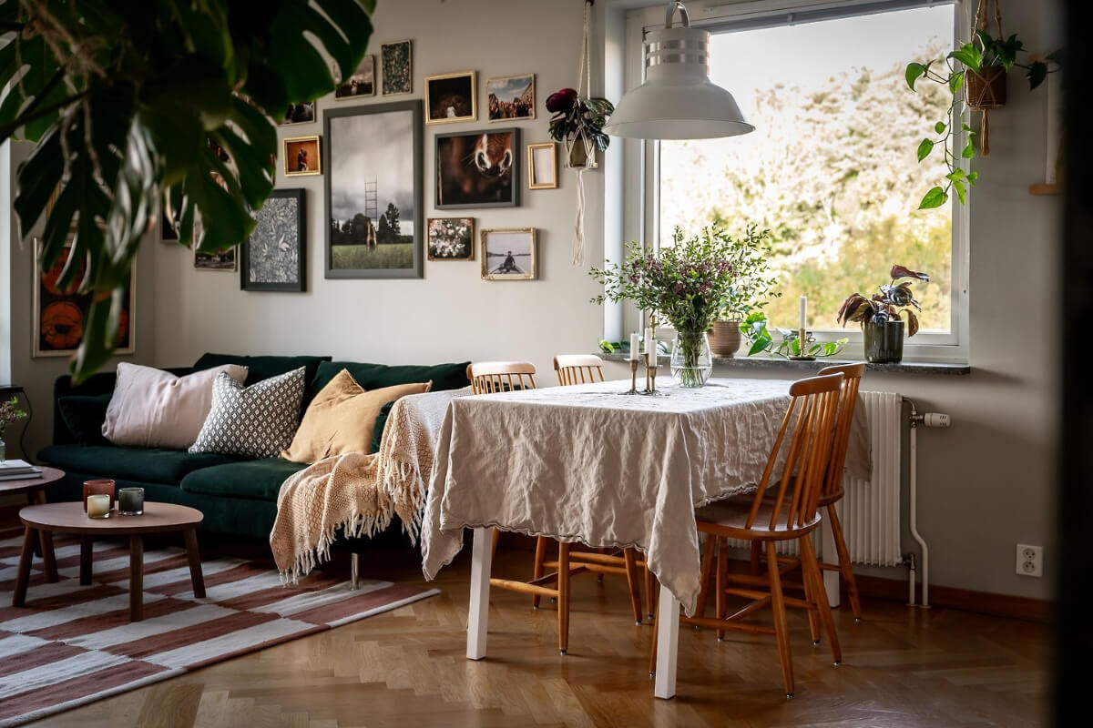 A Charming Apartment with Large Windows and Colorful Bedrooms 8 dining table large window living room