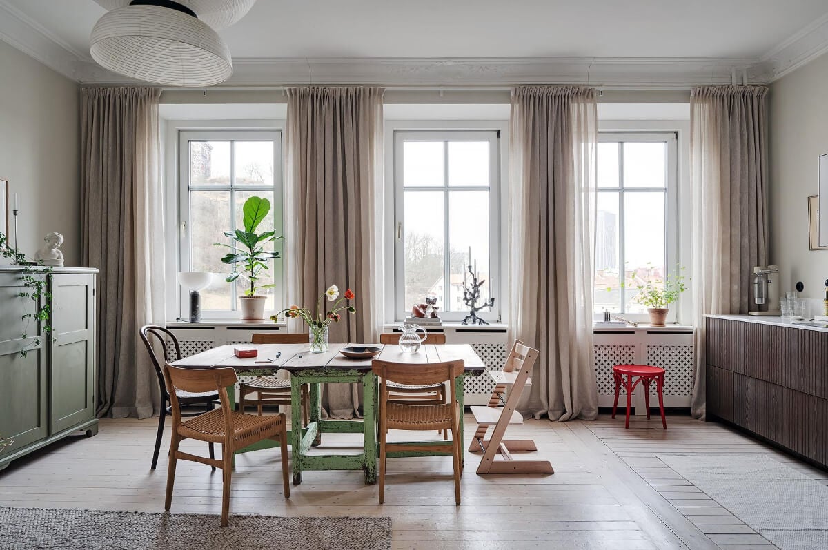 Period Features and Modern Materials in a Swedish Apartment 8 dining table mixture of chairs