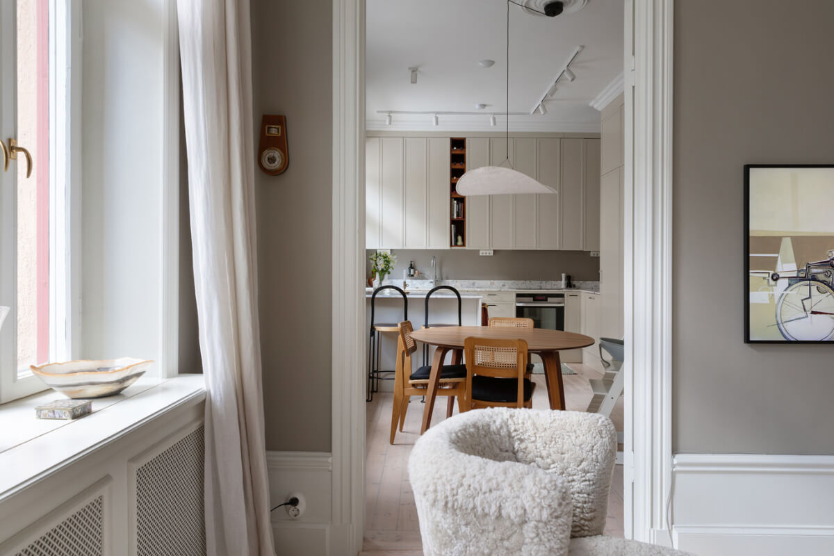 A Calm, Neutral Color Palette in a Classic Swedish Apartment 6 doorway to kitchen