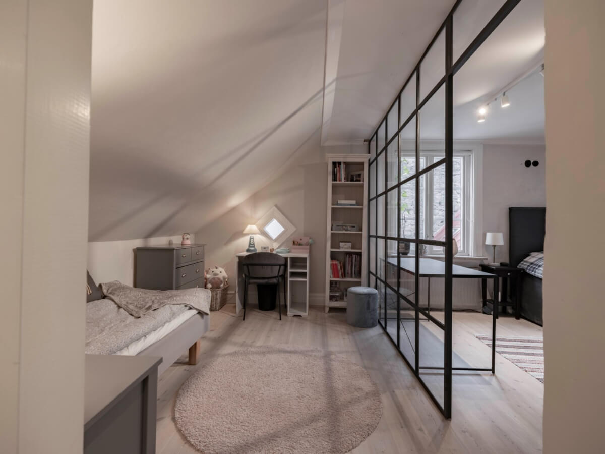 A Renovated 19th-Century Villa on Gotland 25 double attic bedroom steel framed glass room divider