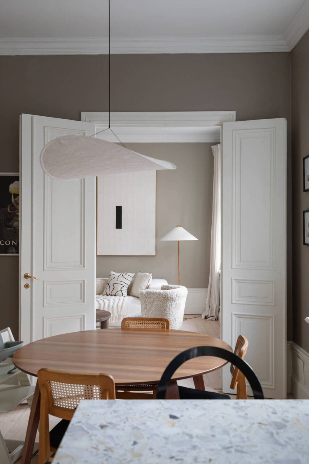A Calm, Neutral Color Palette in a Classic Swedish Apartment 15 double wooden doors living room kitchen