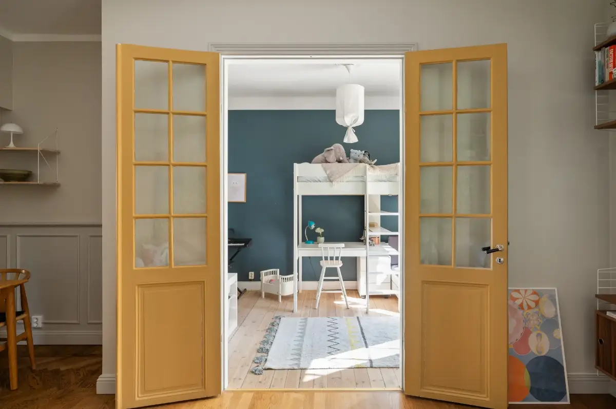 A Charming Ground Floor Family Apartment in Stockholm 10 double yellow doors to childrens room