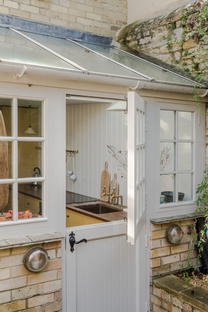 A Carefully Selected Color Palette in an 18th-Century English Cottage 9 dutch door kitchen