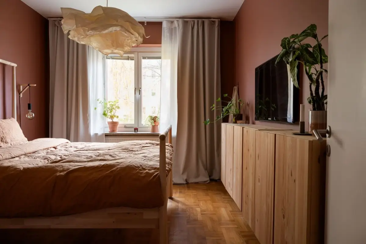 A Swedish Apartment with a Dutch Parquet Floor and Terracotta Bedroom 14 earthy pink bedroom ikea ivar cabinets