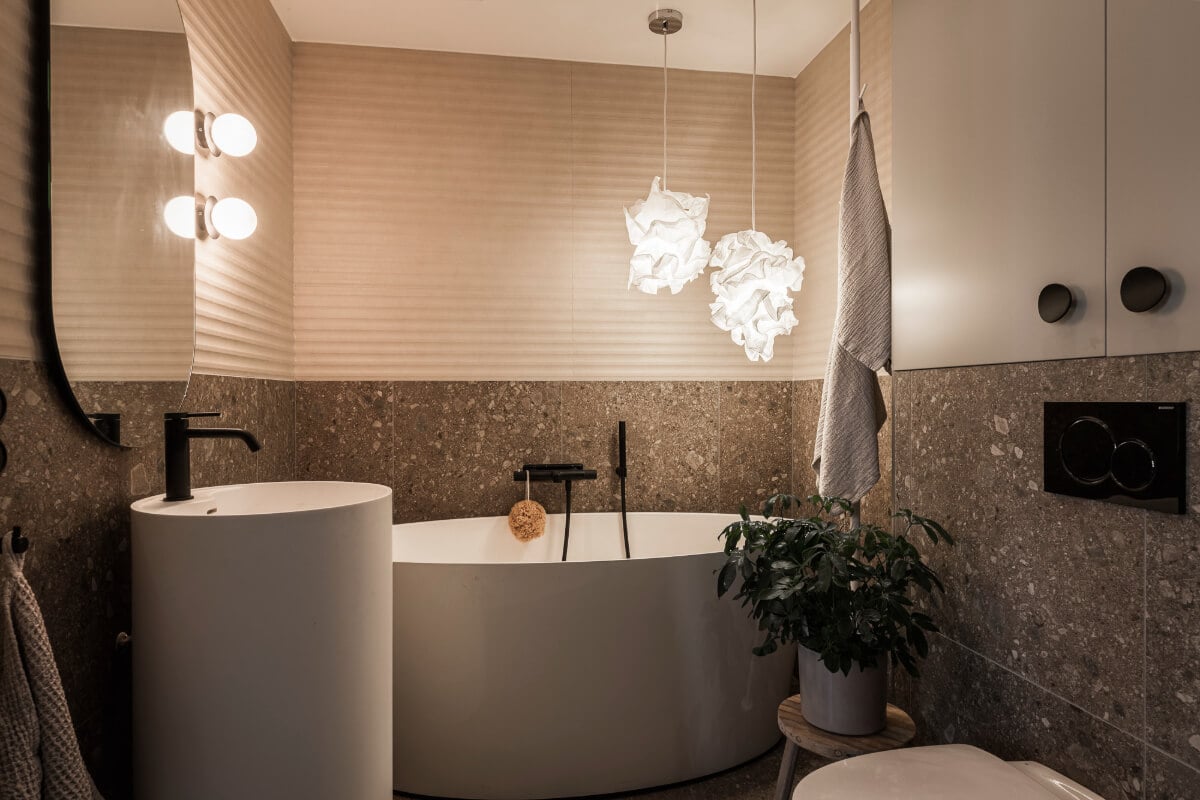 A Swedish Apartment with Exclusive Materials and Monochrome Color Scheme 23 en-suite bathroom with freestanding bath